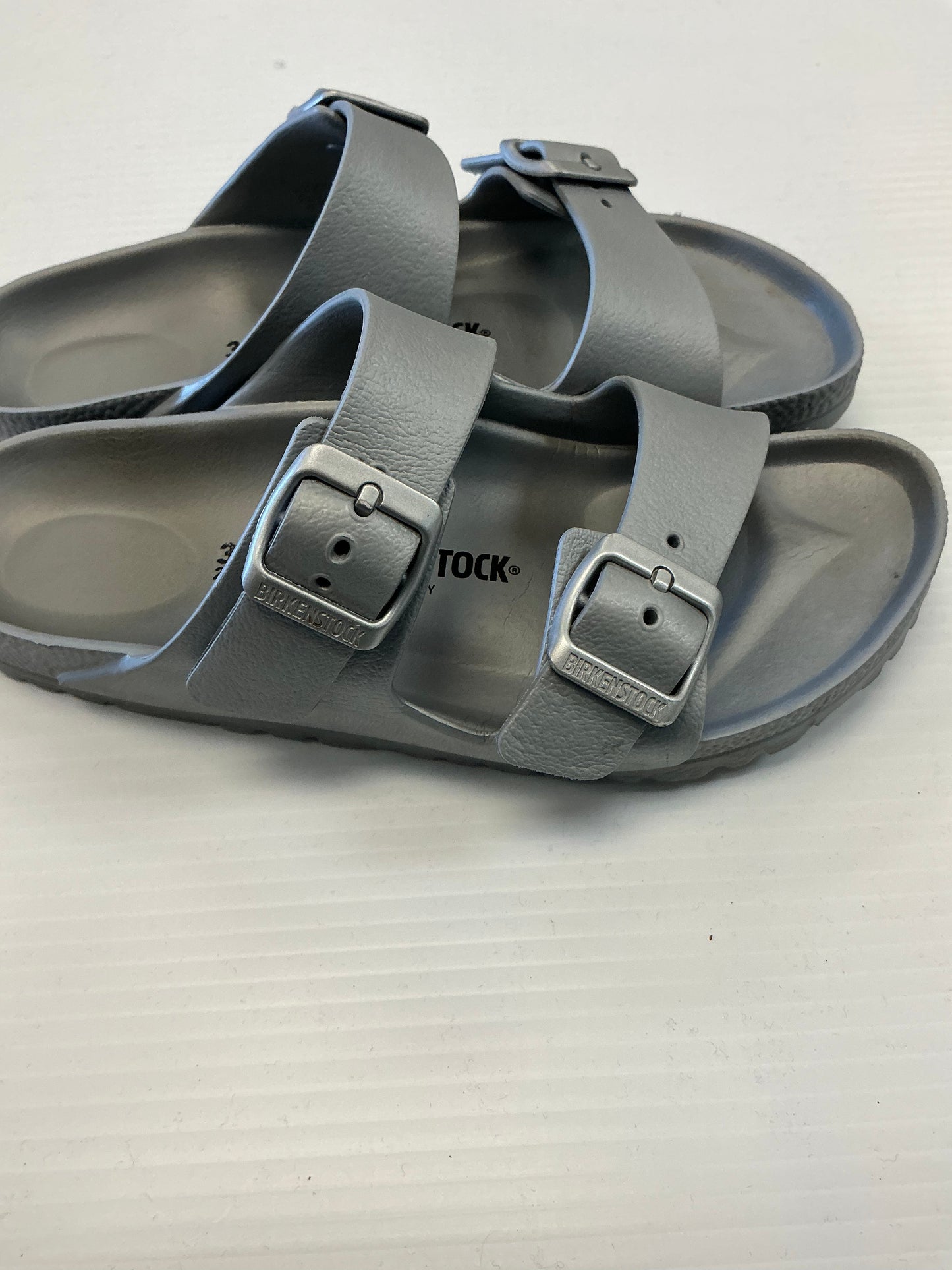 Sandals Flats By Birkenstock In Silver, Size: 5